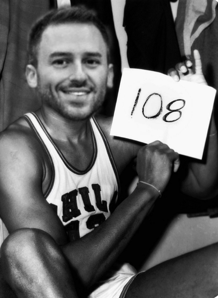 Brian holding a 108 sign
